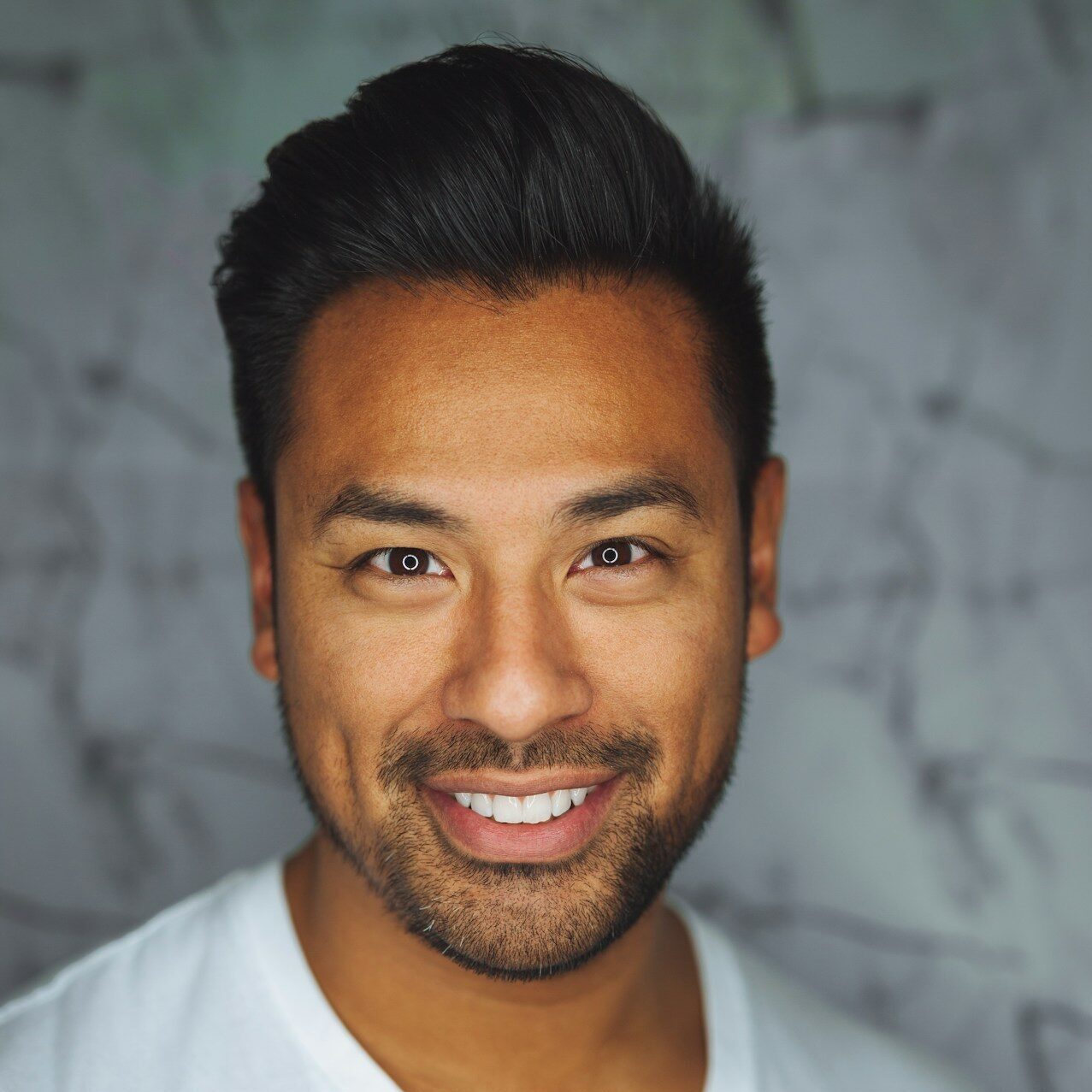 man wearing white V-neck shirt