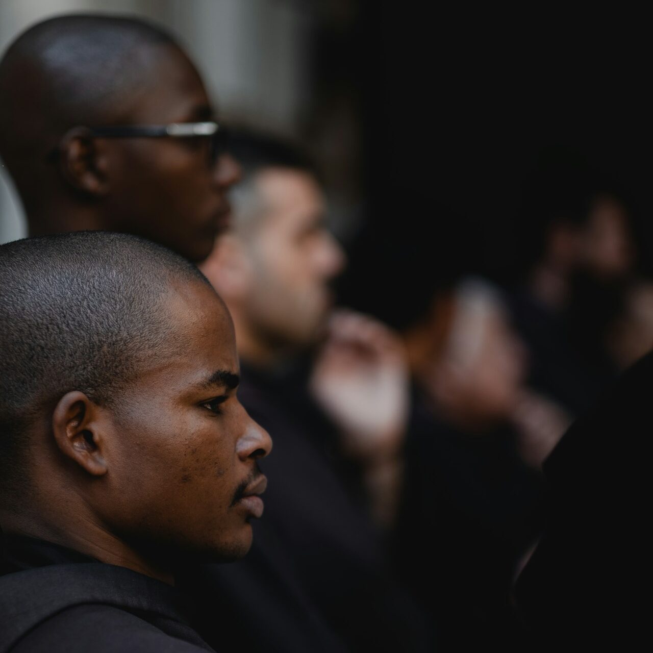 a group of men standing next to each other
