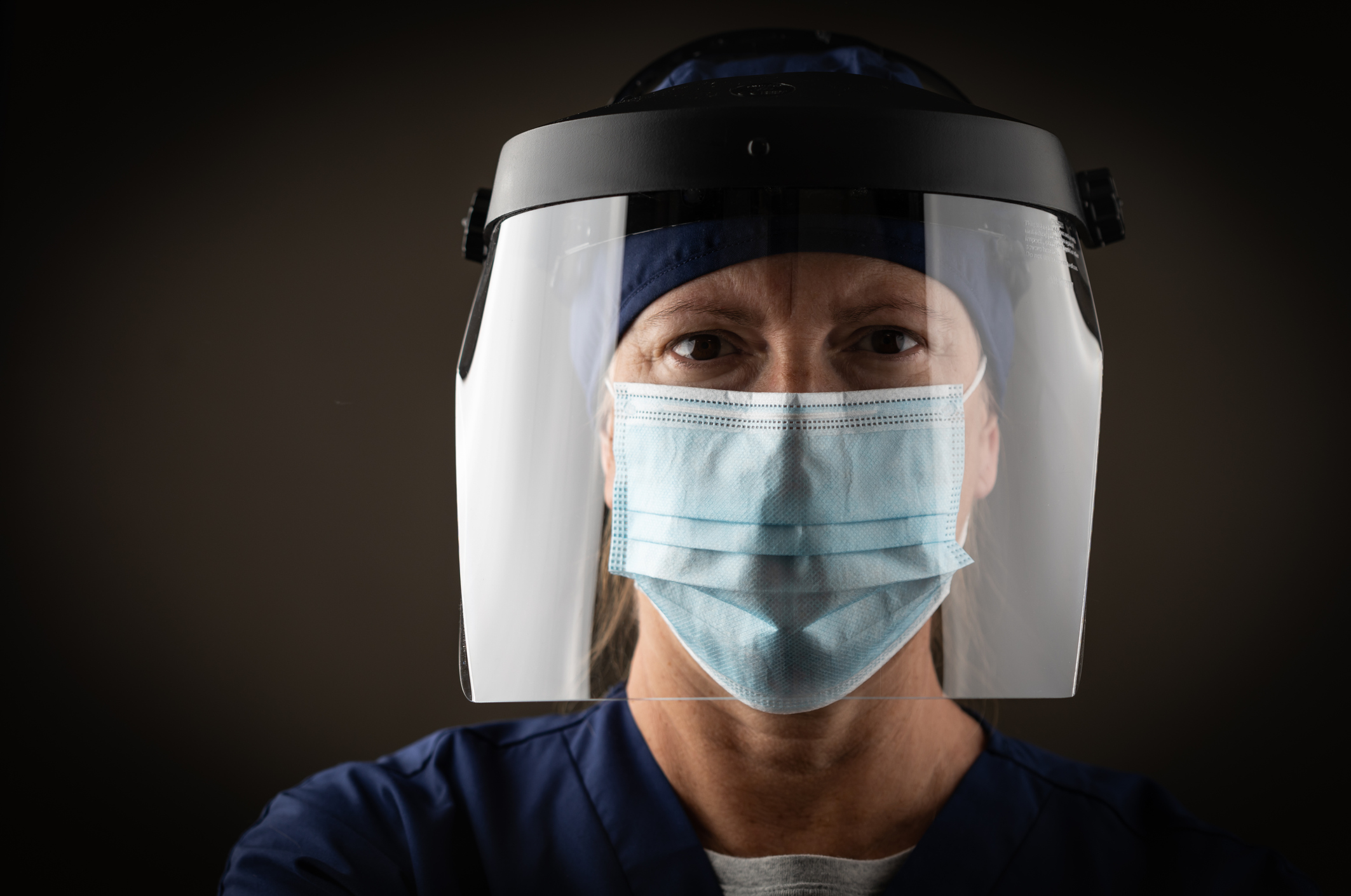 stock photo of medical worker with face mask and shield – North ...