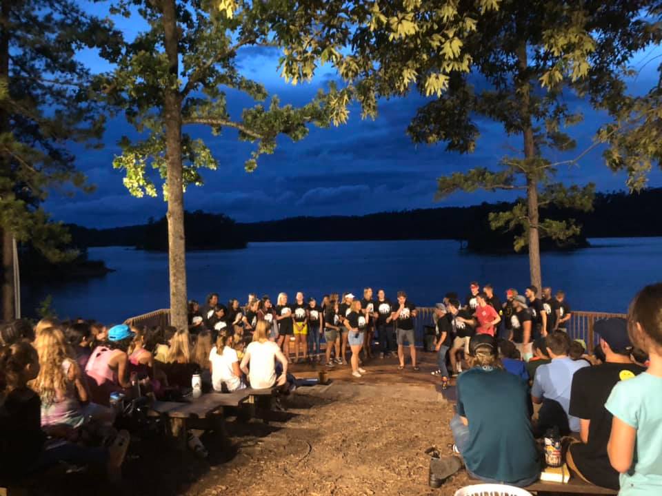 Yorktown Bay campers at an evening program by the lake. Photo: Camp Yorktown Bay Facebook Page