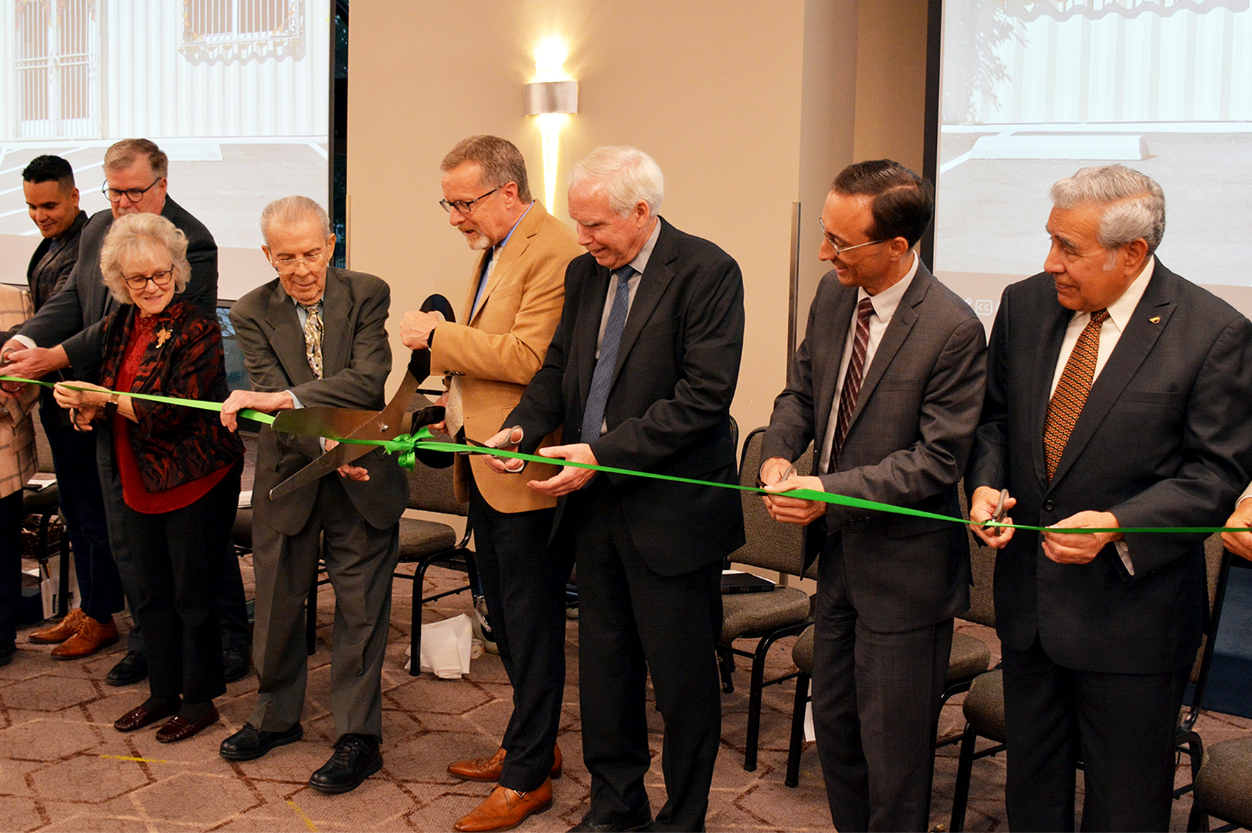 Randy Roberts, senior pastor of Loma Linda University Church, mans the oversize scissors as he and the other dignitaries prepare to cut the ceremonial ribbon for the Loma Linda University Church Literature Ministry Distribution and Training Center.