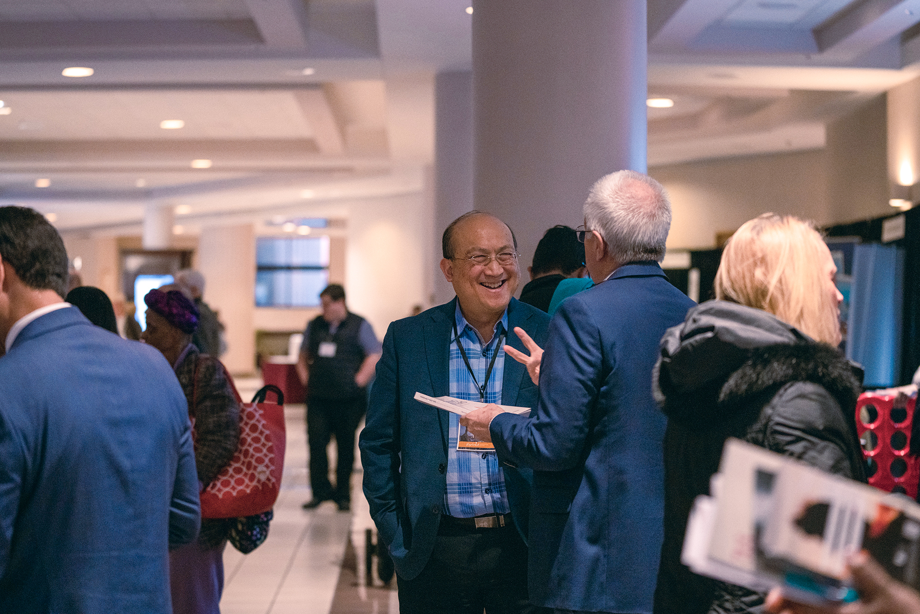 Friends share a laugh in the exhibit hall of the North American Division's Adventist Ministries Convention.