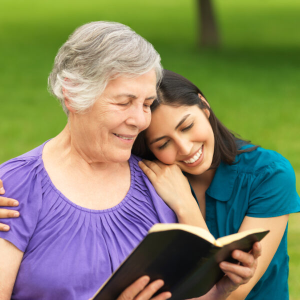 Stock photo of mom and daughter, adult, in Bible study