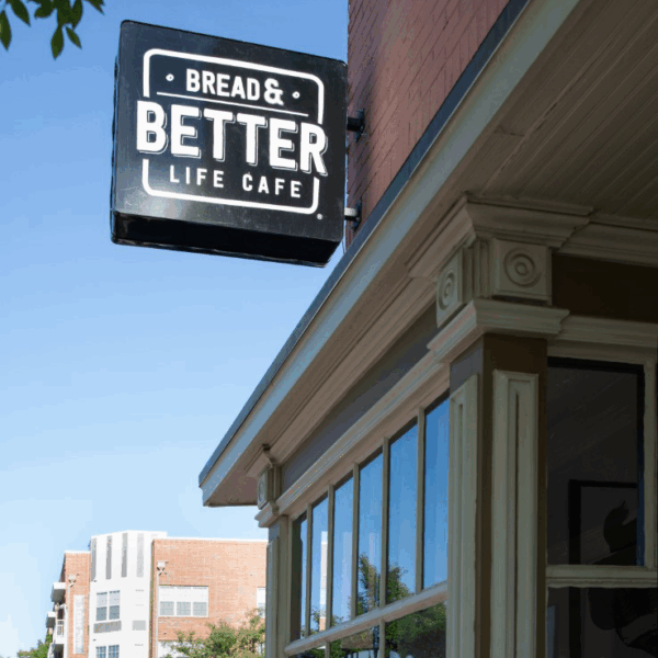 Outdoor sign of Bread and Better Life Cafe