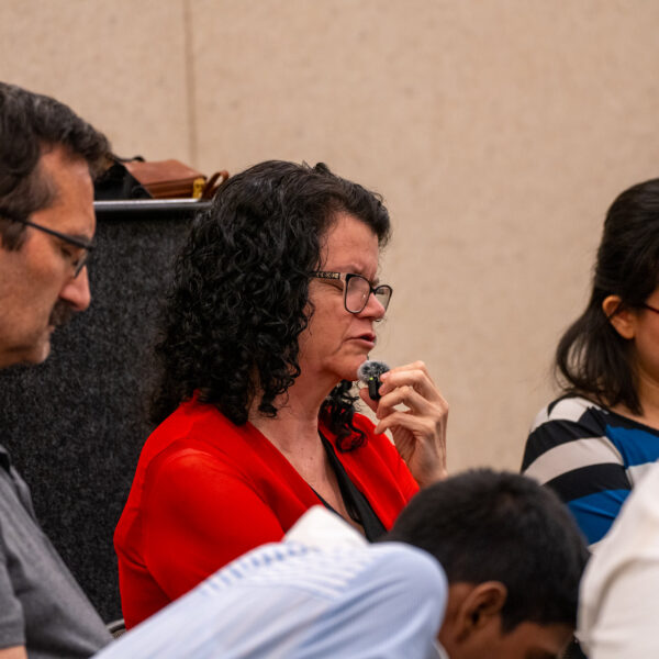 Karen Glassford, director of GC's Digital Strategy for Mission, leads a round of prayer.