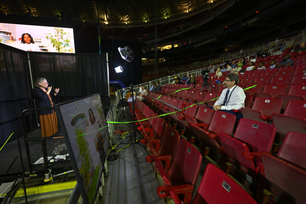 Interpreter signs for Deaf Delegate Jeff Jordan.
