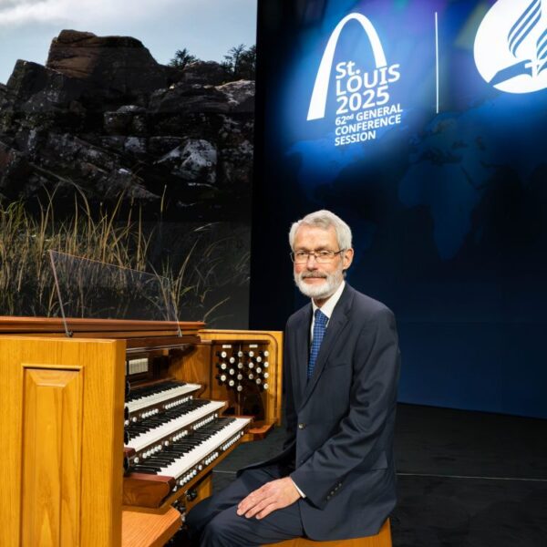 Ken Logan sits at the Organ.