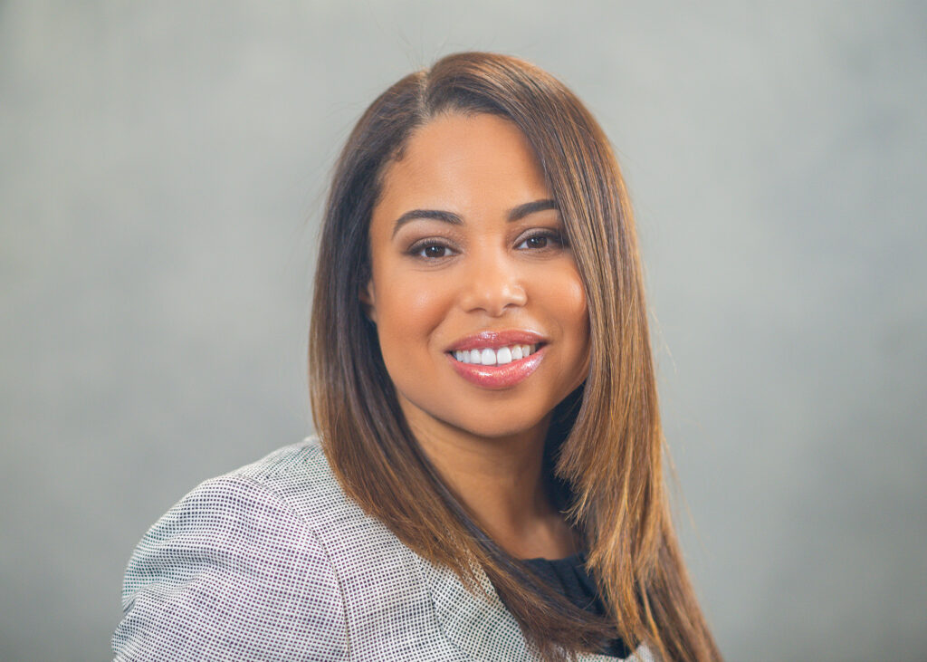 Headshot of a woman in a suit. 