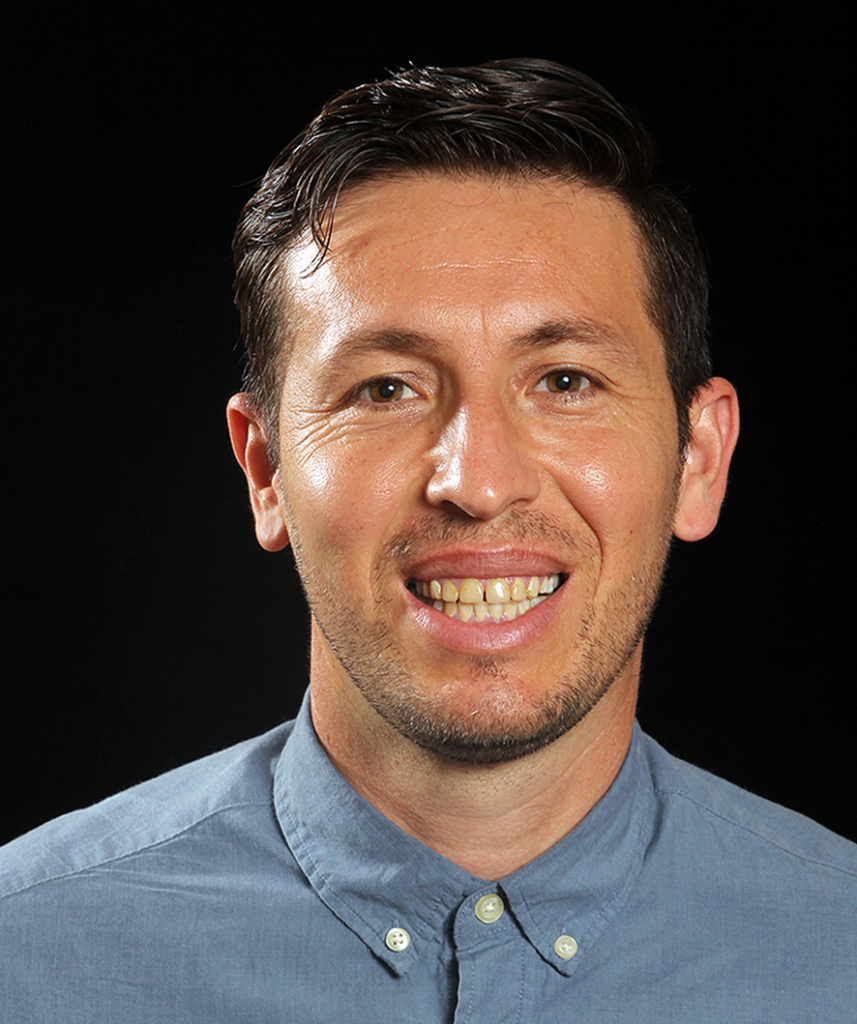 Headshot of a man in a dress shirt