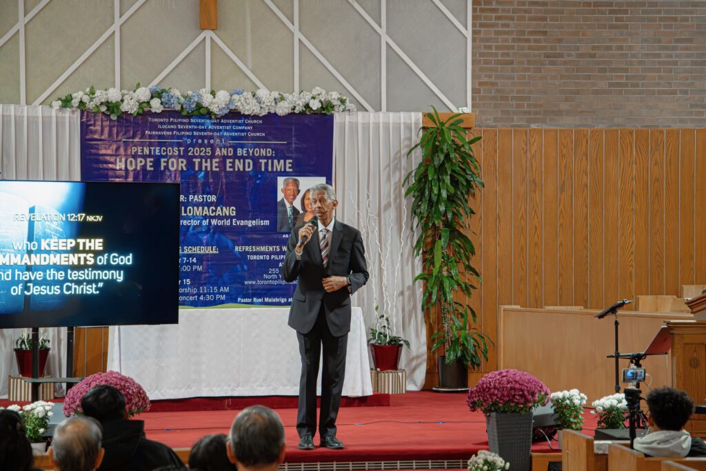 Photo of man preaching in front of a congregation