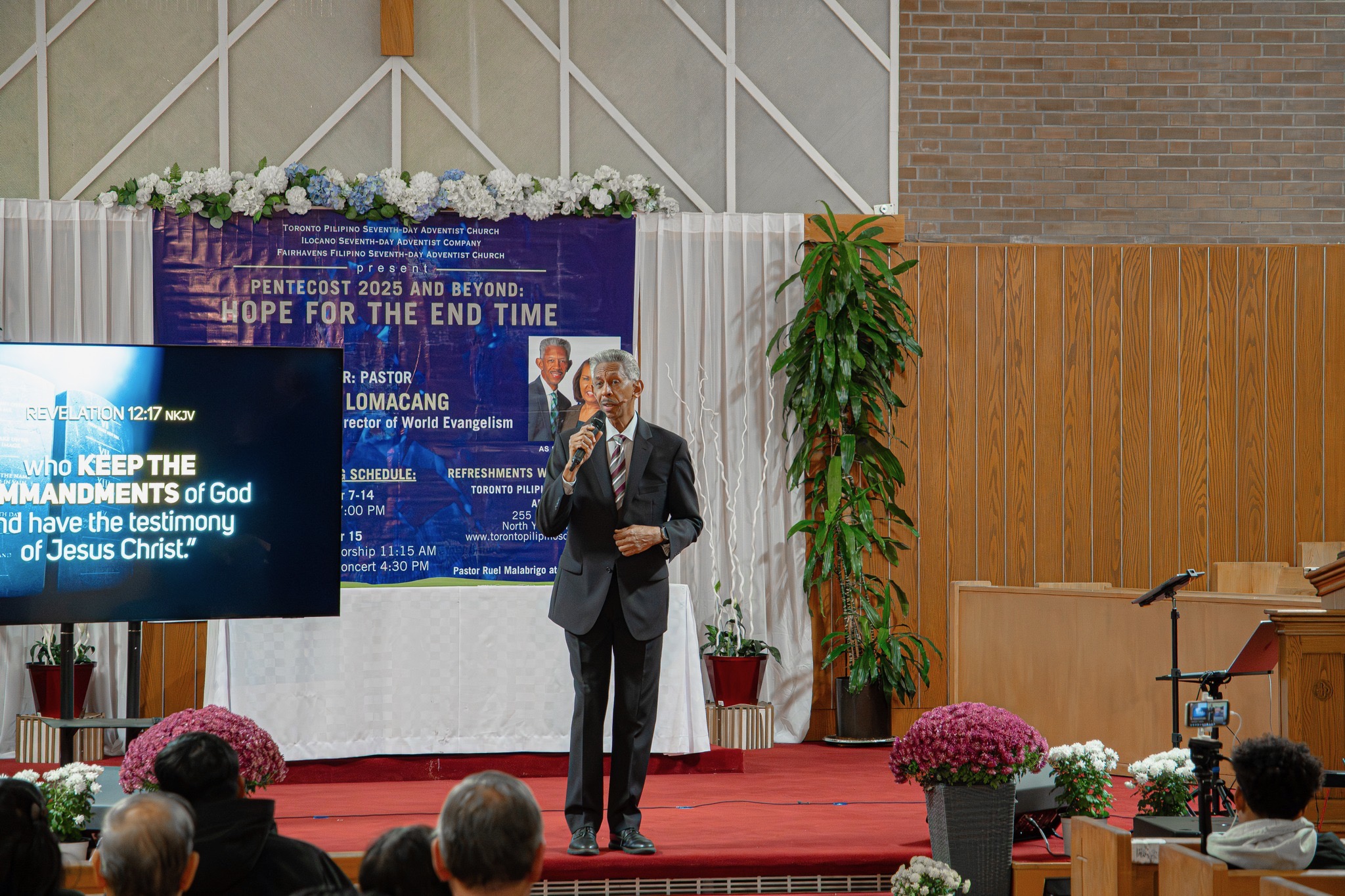 Photo of man preaching in front of a congregation
