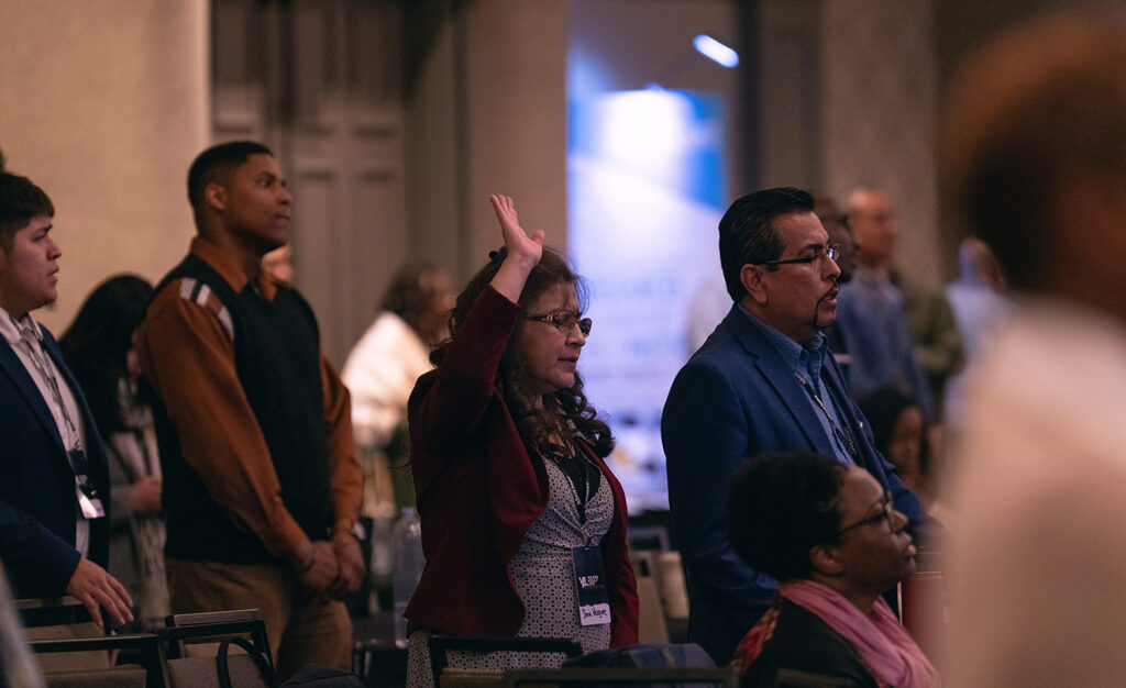 A photo of people worshiping together.