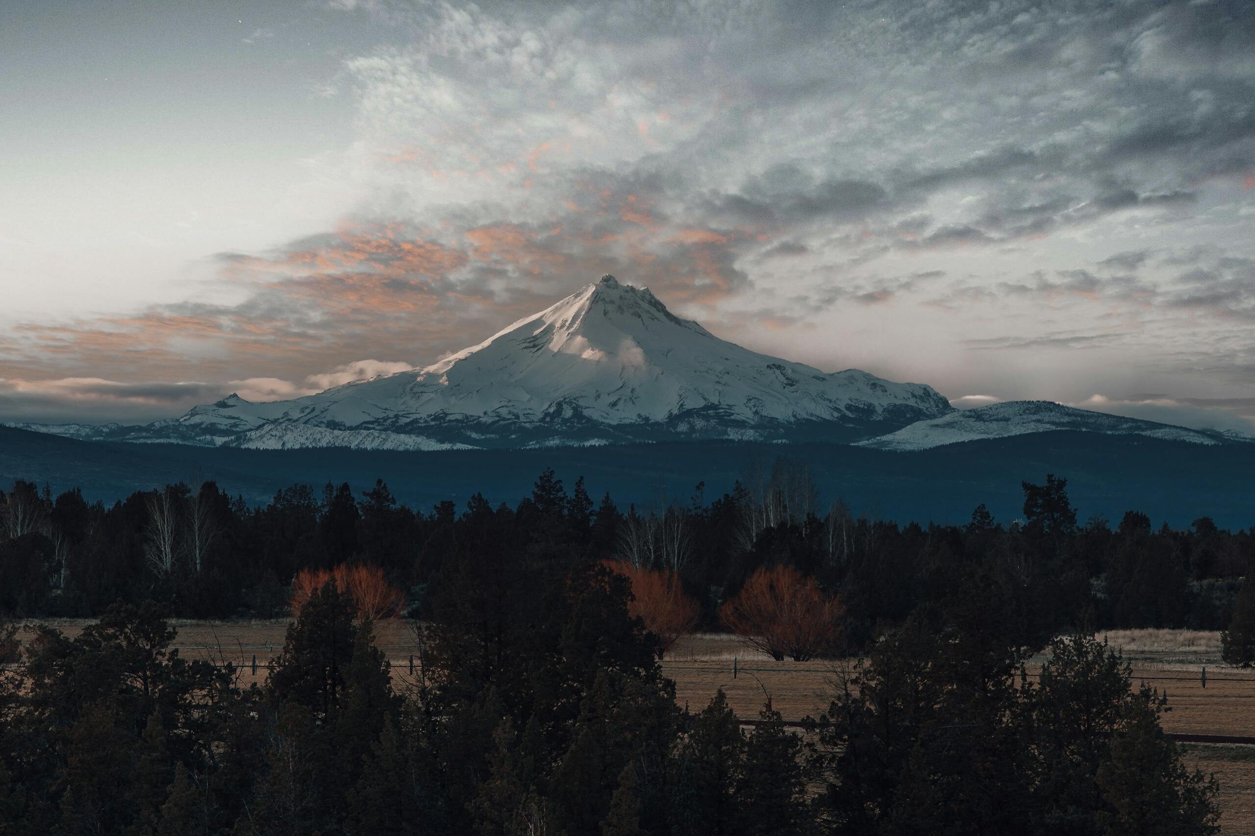 Capture the serene beauty of Mount Hood during a stunning sunset in Oregon.