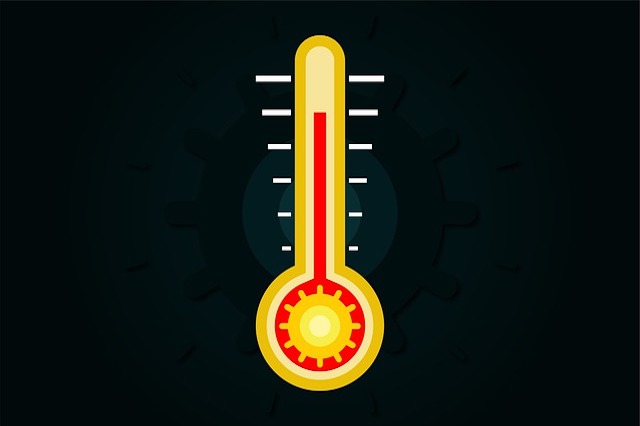 Yellow thermometer with red mercury on a black background