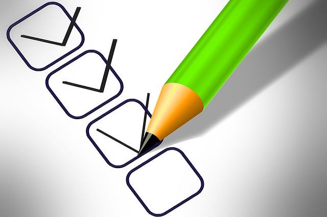 A checklist with a green pencil