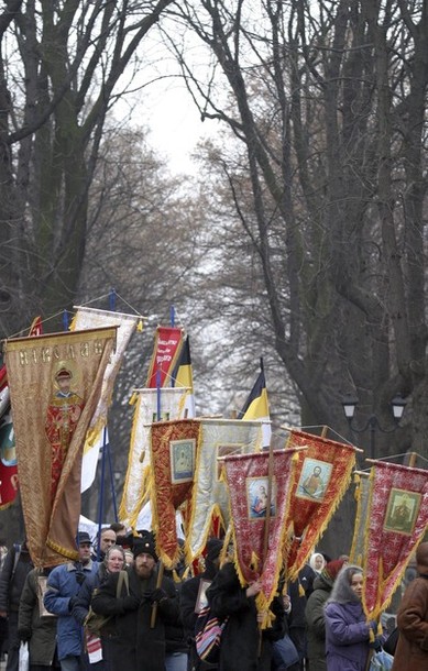 Orthodox believers carry church banners during a procession marking the 354th anniversary of the Pereyaslav Council in Kiev.