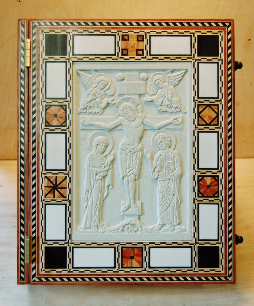 The front cover - inlaid woods and ivory with carved steatite icon