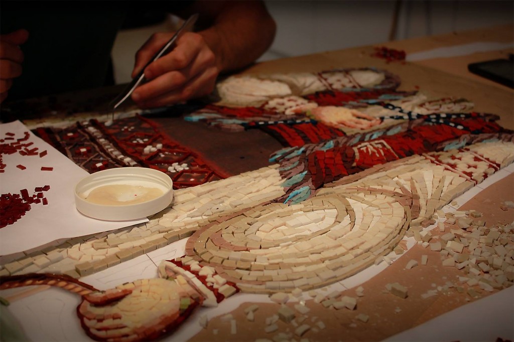 Artist working on a mosaic