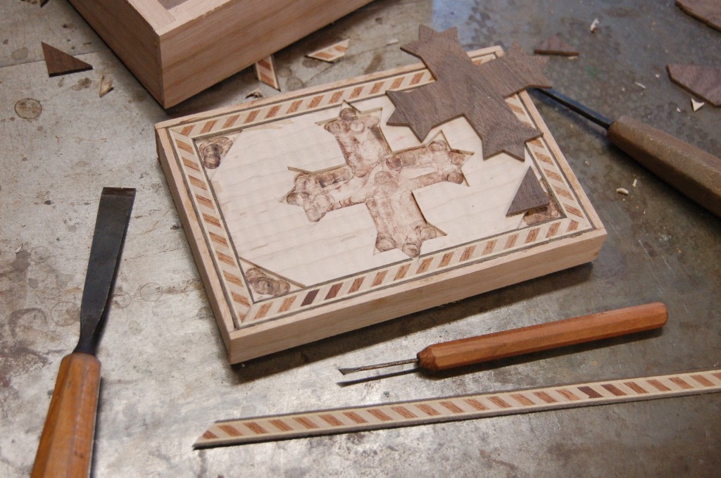 Inlaying the walnut cross into the incense box