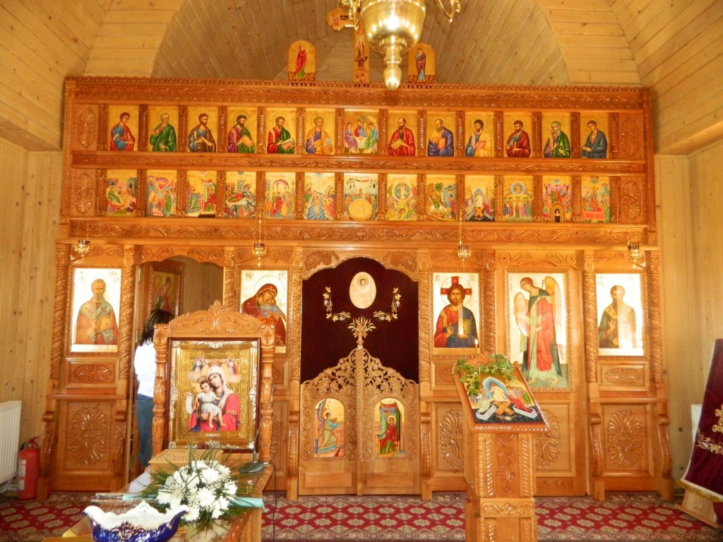 The Iconostasis of the Church of Saint Basil the Great, Curtea de Arges, Romania. This is a rather successful icon screen, because the warm gold color of the wood integrates well with the icons, and the simple design of the screen does not distract from the relationships between the icons.