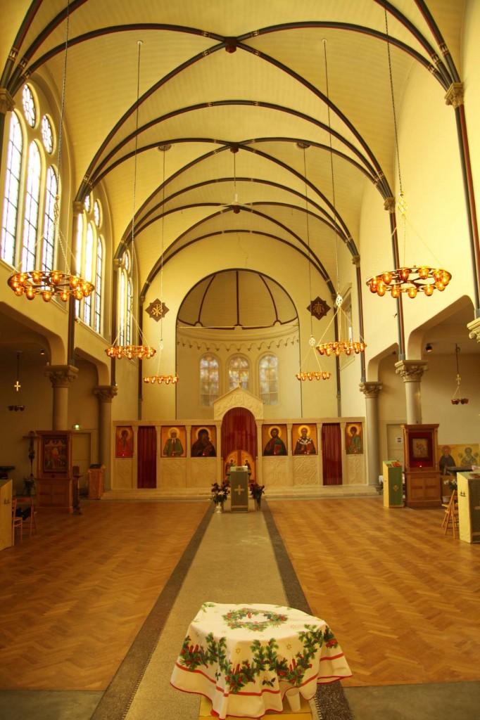 St Nicholas Russian Orthodox Church, Amsterdam, showing how chandeliers can be used to lower the ceiling and so create a more intimate space in an otherwise tall building.