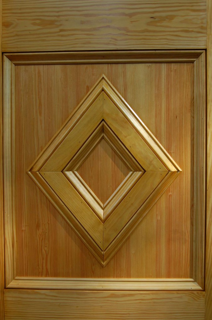 The bottom panels are made from 3/4" pine boards outlined with panel moulding (a.k.a. baseboard moulding).
