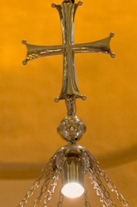 The apex cross of the choros, likewise with a channel to conceal the wires.