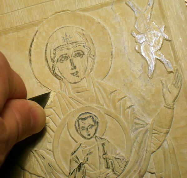 Carving a steatite icon. 