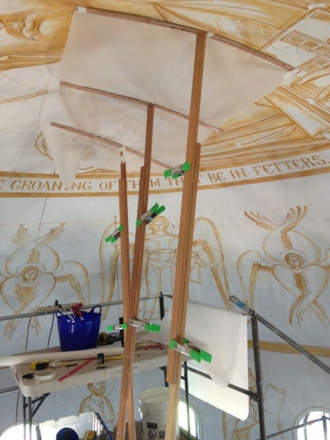 Elements of the original sepia drawing that need to be saved are traced onto paper prior to application of plaster.