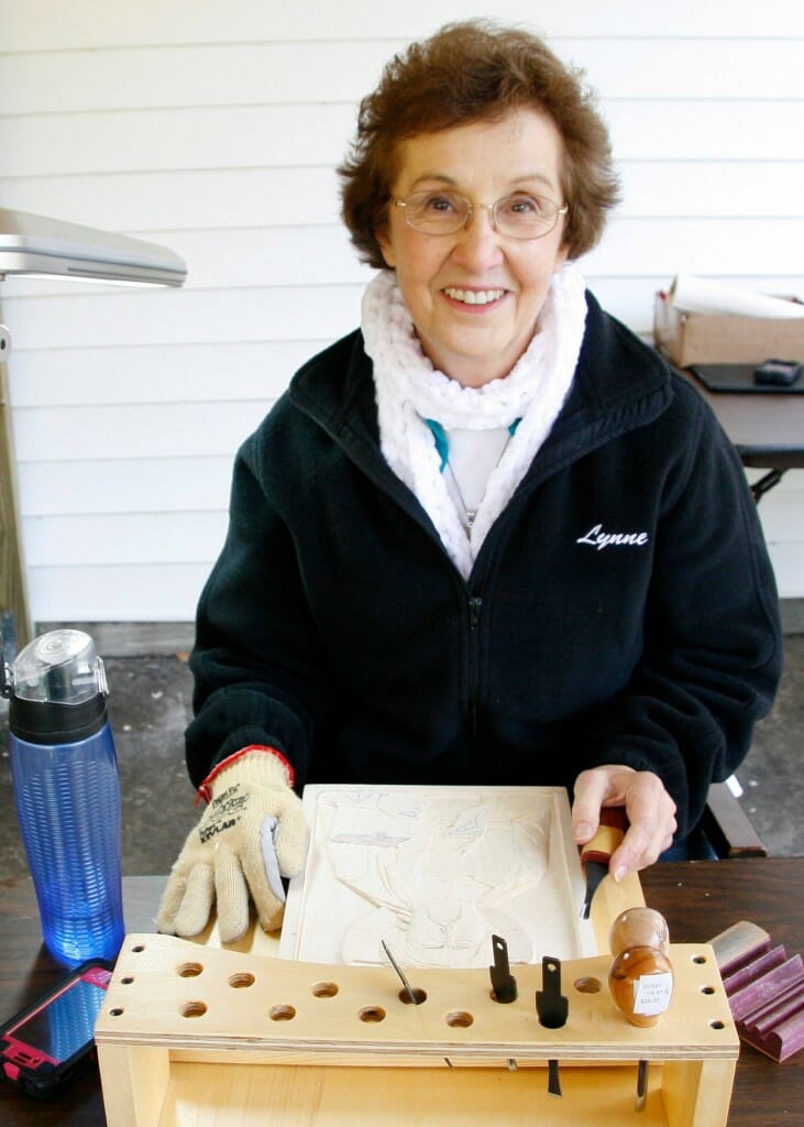Lynne Attaway enjoying the hard work of carving full time for six days. 
