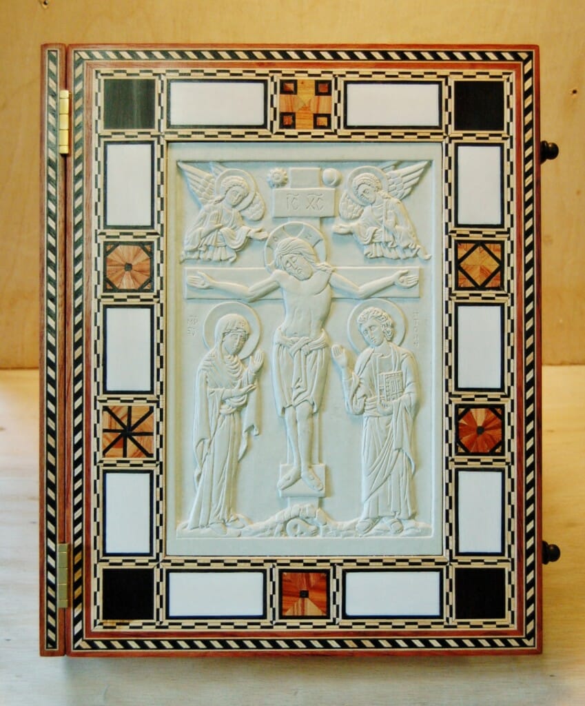 The front cover - inlaid woods and ivory with carved steatite icon