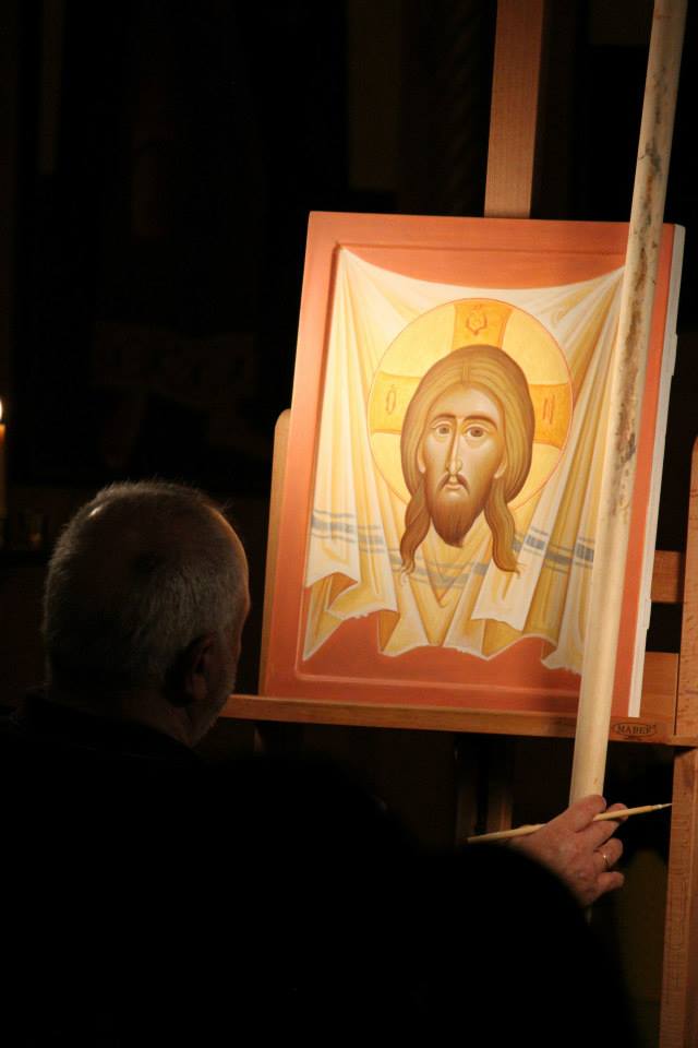 Kordis finishing up his icon painted during the two concert events.  Credit: Odarka Kish
