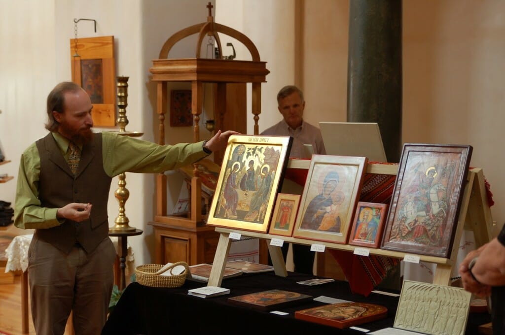 Andrew Gould explaining the exhibition of icons