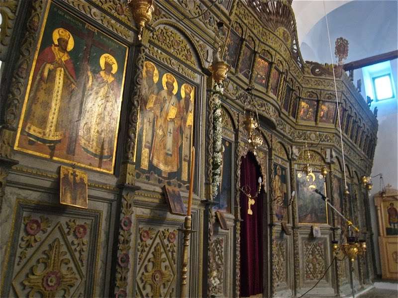 Xinovrysi, Greece, Dormition Church. This screen, made in 1819, has an unusual dark color scheme which perfectly integrates with the dark palette of the icons.