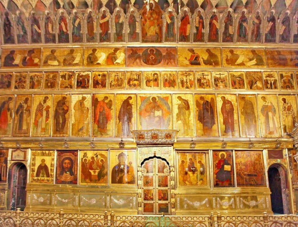 The 15th-century iconostasis in Holy Trinity Cathedral at Serguiev Possad, Russia. Typical of an early Russian screen, the structure between the icons is as discreet as possible. 