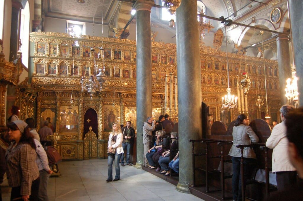 From a distance, this iconostasis seems alive with fiery light and energy, and establishes a magnificent liturgical ethos in a structure that would otherwise be dull, with its flat gray color scheme.