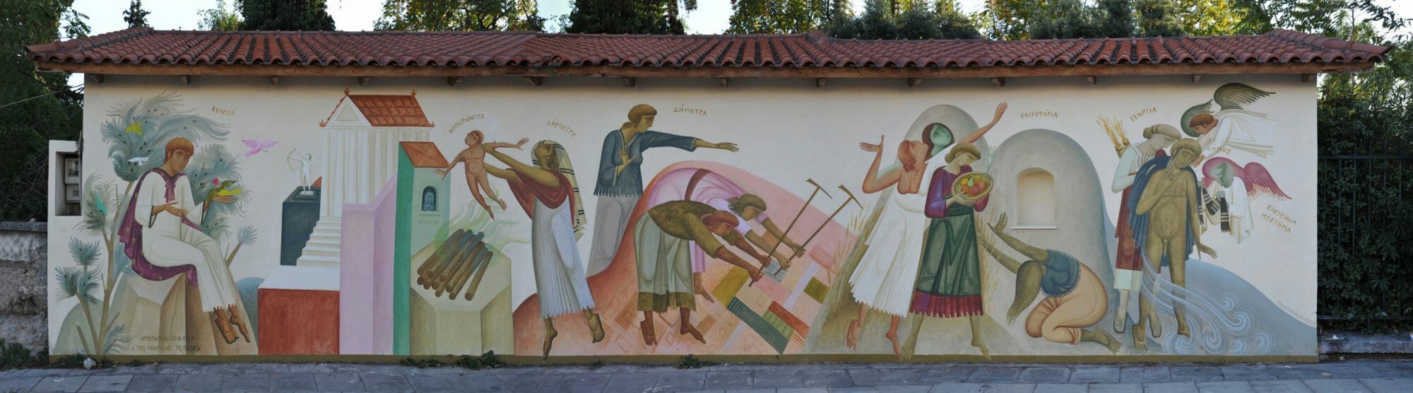 The Formation of the Demos (municipality) in Athens, by Fikos, 2012. Acrylic colors on wall, 14.5×3.3 m. Sacred Way (Iera Odos), blind side of a warehouse at the Agricultural Department of the University of Athens. 