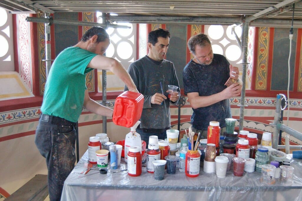 The three painters - Vladimir, Aleko, and Dmitri, mixing paints.