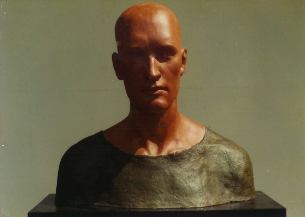 Man in Green Shirt. By Aidan Hart, 1982. Ceramic, pigmented plaster, fabric.
