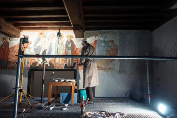 Joris Van Ael paints fresco on the walls of the first church