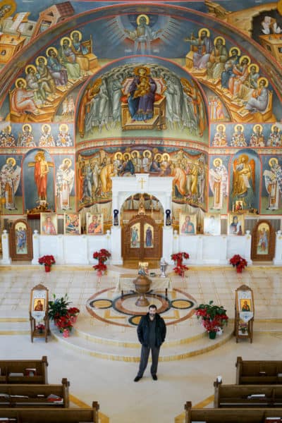 Dionysios Bouloubassis stands in front of the completed altar area