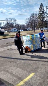 Volunteers Help Unload Water in Flint, Donated by Marvin Sapp and Lighthouse Full Life Center